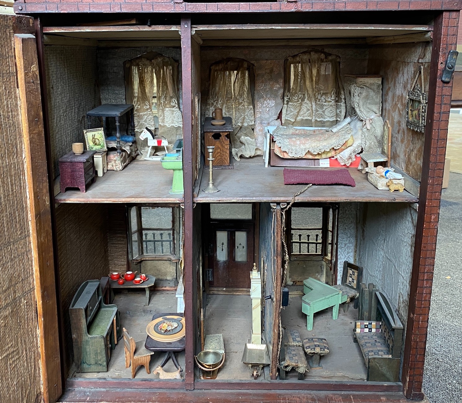 A back-opening furnished English dolls’ house, late 19th century, 74cm high